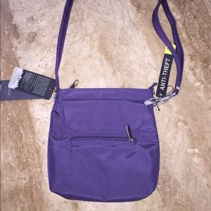 Travelon anti theft crossbody purple bag